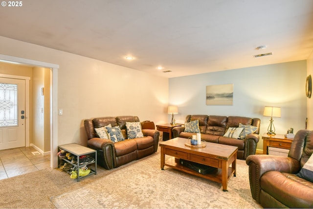 tiled living room featuring recessed lighting and carpet floors