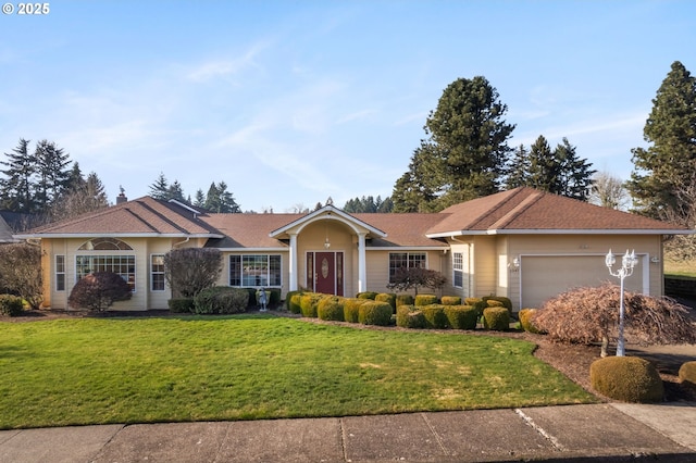 single story home featuring a garage and a front lawn