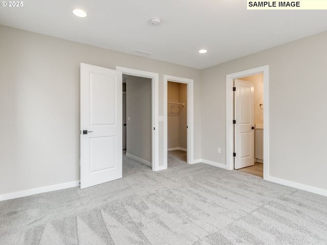 732 NW 178th Way, Ridgefield, WA 98642 - unfurnished bedroom featuring carpet flooring, a spacious closet, baseboards, recessed lighting, and connected bathroom