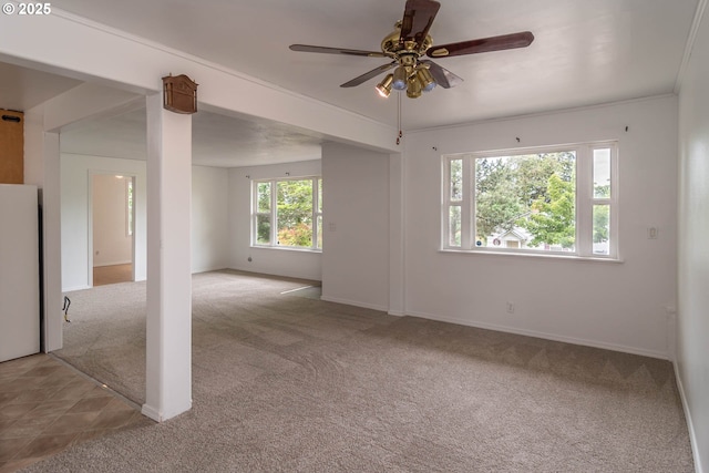 731 NE Casper St, Roseburg, OR 97470 - empty room with light colored carpet, ceiling fan, and baseboards