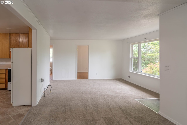 731 NE Casper St, Roseburg, OR 97470 - spare room featuring baseboards and light carpet