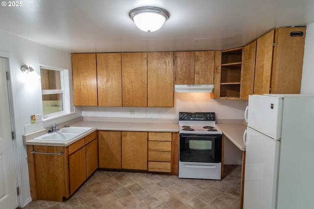 731 NE Casper St, Roseburg, OR 97470 - kitchen featuring freestanding refrigerator, range with electric cooktop, under cabinet range hood, and light countertops