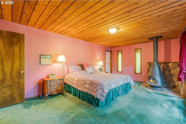 65257 E Sandy River Ln, Rhododendron, OR 97049 - bedroom with carpet floors, wood ceiling, and a wood stove