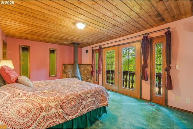 65257 E Sandy River Ln, Rhododendron, OR 97049 - carpeted bedroom with multiple windows, access to exterior, french doors, and wooden ceiling