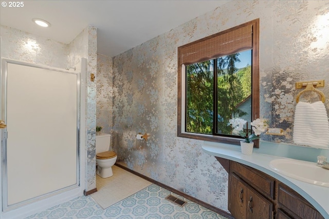 65257 E Sandy River Ln, Rhododendron, OR 97049 - bathroom featuring wallpapered walls, vanity, a stall shower, toilet, and baseboards