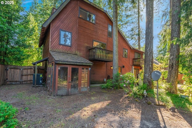 65257 E Sandy River Ln, Rhododendron, OR 97049 - back of house with cooling unit, a gate, a balcony, and roof with shingles