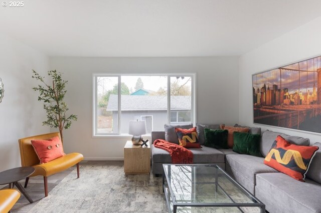 living room with wood finished floors and baseboards