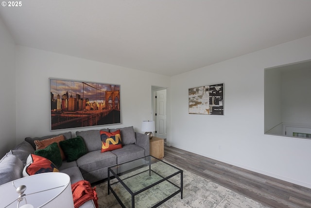 living area featuring wood finished floors and baseboards