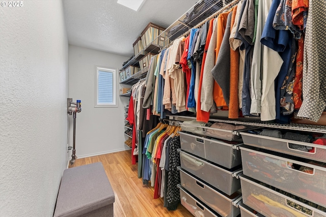 spacious closet with wood finished floors