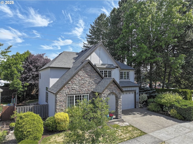 7125 SW Fallen Leaf St, Wilsonville, OR 97070 - view of front of property with stone siding, concrete driveway, a garage, and stucco siding