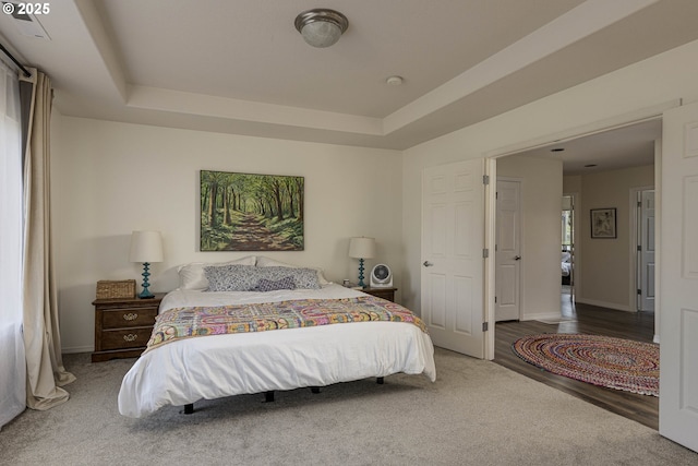 7125 SW Fallen Leaf St, Wilsonville, OR 97070 - bedroom featuring a tray ceiling and wood finished floors