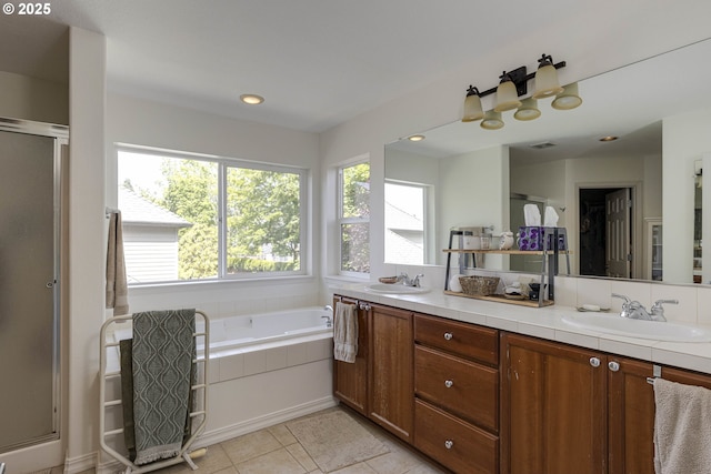 7125 SW Fallen Leaf St, Wilsonville, OR 97070 - full bathroom with a bath, a shower stall, double vanity, tile patterned flooring, and recessed lighting