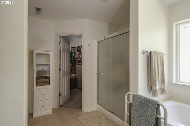 7125 SW Fallen Leaf St, Wilsonville, OR 97070 - full bathroom with a stall shower, a spacious closet, a bath, and tile patterned floors