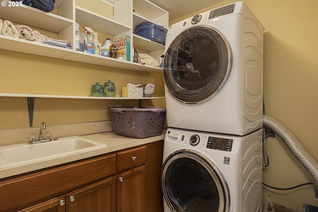 7125 SW Fallen Leaf St, Wilsonville, OR 97070 - washroom with estacked washer and dryer and cabinet space