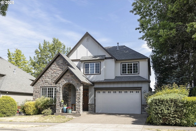 7125 SW Fallen Leaf St, Wilsonville, OR 97070 - view of front of house featuring stone siding, driveway, stucco siding, a garage, and a shingled roof