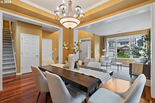 dining room featuring dark wood-style floors, baseboards, stairs, and a chandelier