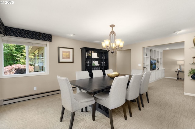 1615 Kingwood St, Forest Grove, OR 97116 - dining room with a chandelier, a baseboard radiator, light carpet, and baseboards