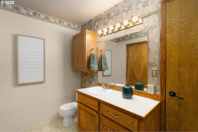 1615 Kingwood St, Forest Grove, OR 97116 - bathroom featuring vanity, toilet, and wallpapered walls