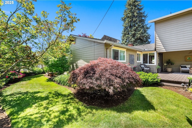 1615 Kingwood St, Forest Grove, OR 97116 - view of home's exterior featuring a wooden deck and a lawn