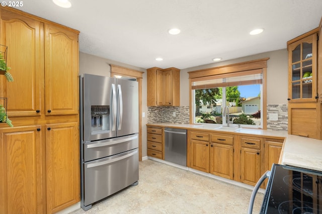 1615 Kingwood St, Forest Grove, OR 97116 - kitchen with stainless steel appliances, light countertops, decorative backsplash, glass insert cabinets, and recessed lighting