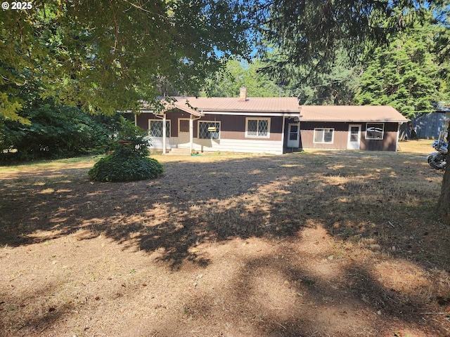 544 Lou Gray Dr, Myrtle Creek, OR 97457 - rear view of property with a chimney and a metal roof
