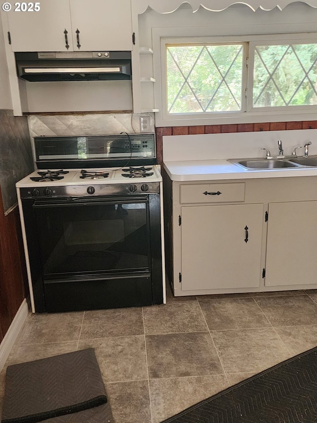 544 Lou Gray Dr, Myrtle Creek, OR 97457 - kitchen featuring range with gas stovetop, exhaust hood, white cabinetry, and light countertops