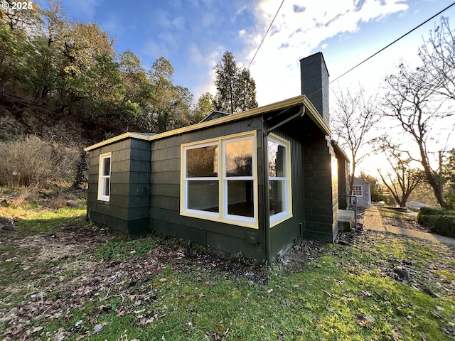 view of side of property featuring a chimney