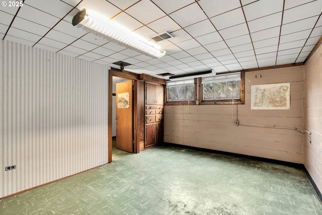 spare room featuring visible vents and tile patterned floors