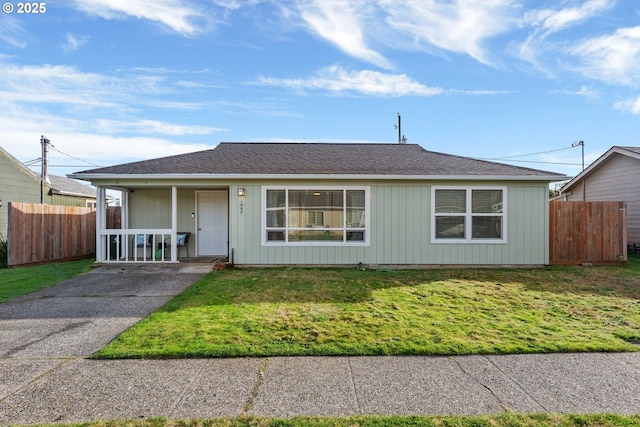 ranch-style home featuring a front yard and a porch