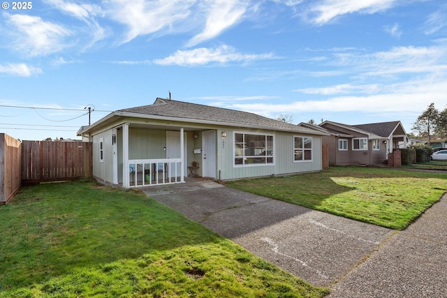 ranch-style house featuring a porch and a front yard