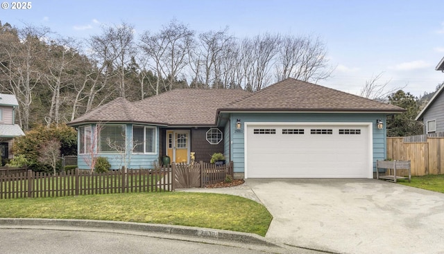 ranch-style home featuring driveway, roof with shingles, an attached garage, fence private yard, and a front lawn