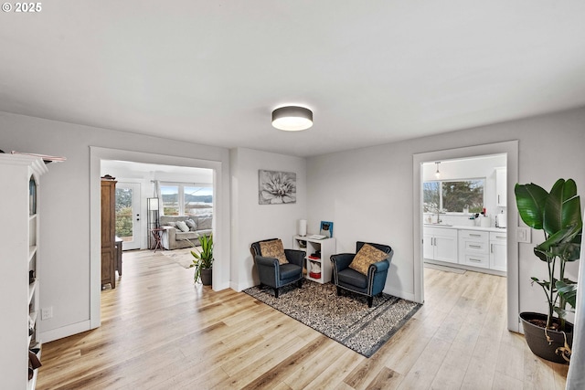 546 W Fir Ave, Coos Bay, OR 97420 - living area with baseboards and light wood-style floors