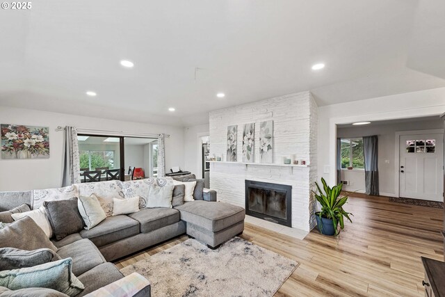 546 W Fir Ave, Coos Bay, OR 97420 - living room with recessed lighting, plenty of natural light, wood finished floors, and a fireplace