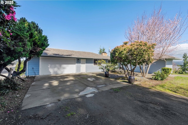 546 W Fir Ave, Coos Bay, OR 97420 - ranch-style home with a chimney and a garage