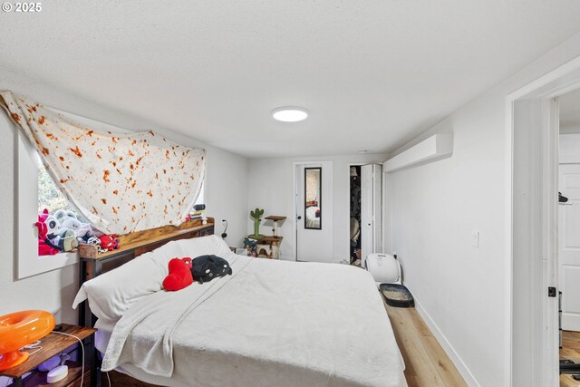 546 W Fir Ave, Coos Bay, OR 97420 - bedroom featuring baseboards and light wood-style floors