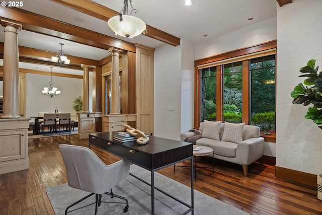 office featuring an inviting chandelier, dark hardwood / wood-style flooring, and ornate columns