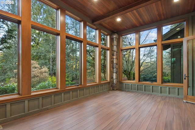 unfurnished sunroom with wooden ceiling and beamed ceiling