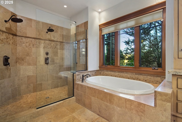 bathroom with vanity and plus walk in shower