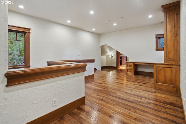 bar with dark hardwood / wood-style floors