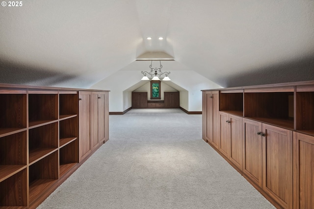 bonus room featuring lofted ceiling and light carpet