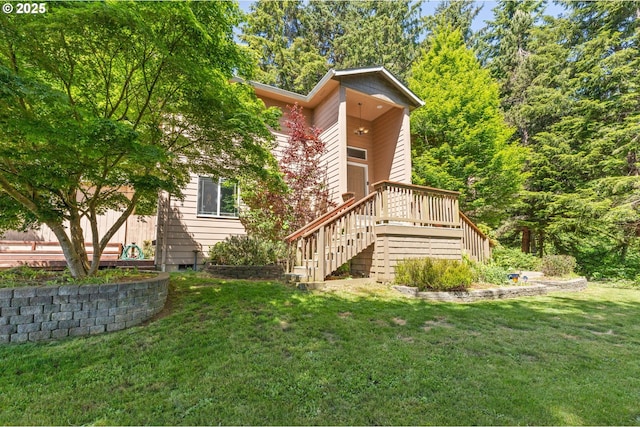 579 S Schooner Creek Rd, Lincoln City, OR 97367 - back of house with stairs, a lawn, and a wooden deck