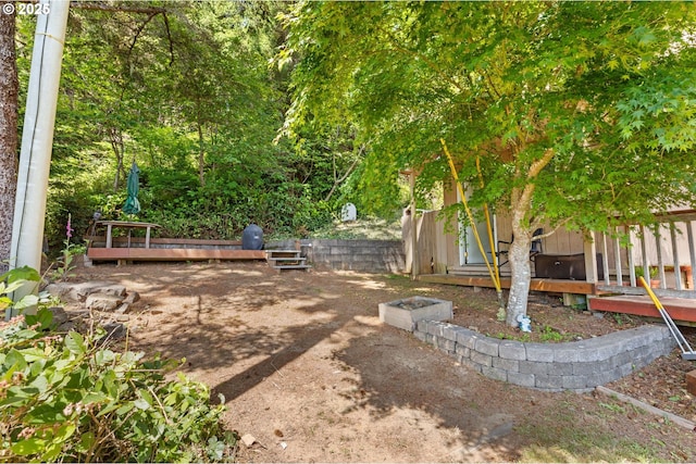 579 S Schooner Creek Rd, Lincoln City, OR 97367 - view of yard with a wooden deck