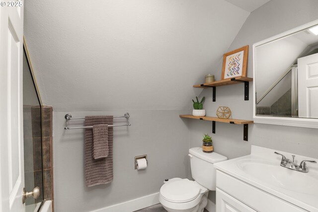 full bathroom with vaulted ceiling, toilet, and vanity