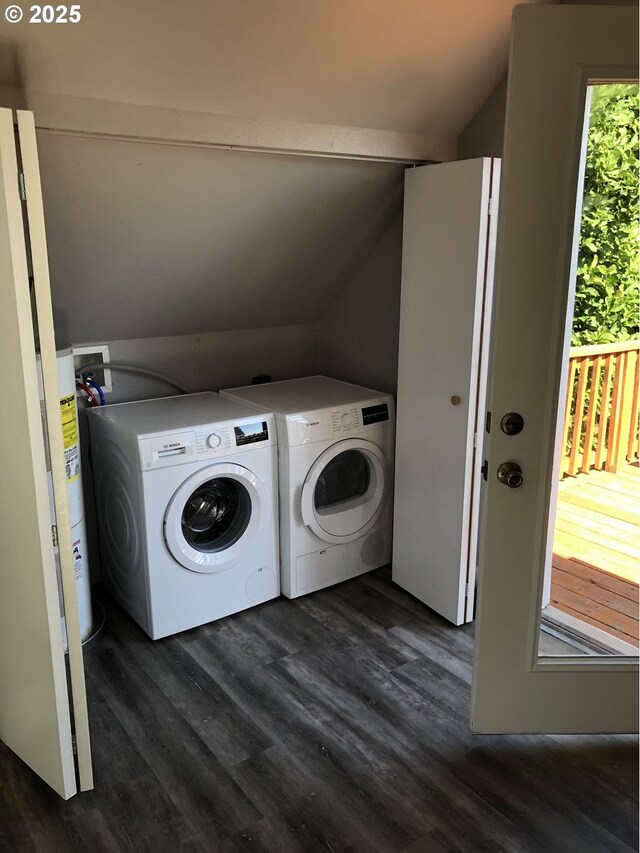 laundry area with dark wood-style floors and washing machine and dryer