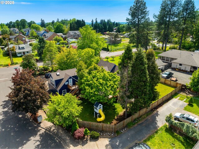 aerial perspective of suburban area with a tree filled landscape
