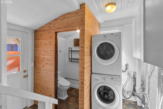 laundry area featuring laundry area and stacked washer and dryer