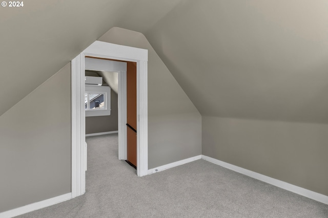 bonus room with baseboards, carpet, and vaulted ceiling