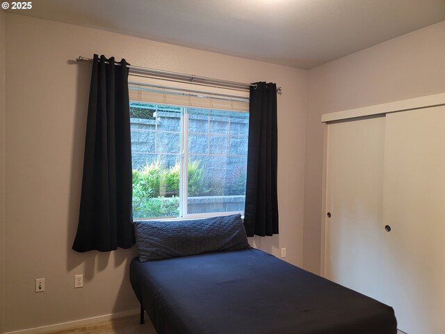 10800 SE 17th Cir Unit M141, Vancouver, WA 98664 - bedroom featuring a closet and baseboards