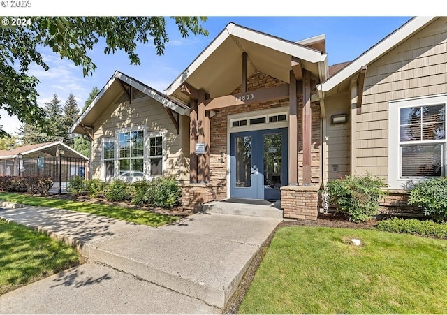 10800 SE 17th Cir Unit M141, Vancouver, WA 98664 - property entrance featuring stone siding, french doors, and a yard