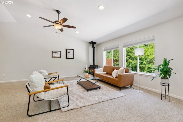 202 Edgewater Dr, Carson, WA 98610 - living room featuring a wood stove, carpet flooring, a ceiling fan, vaulted ceiling, and recessed lighting